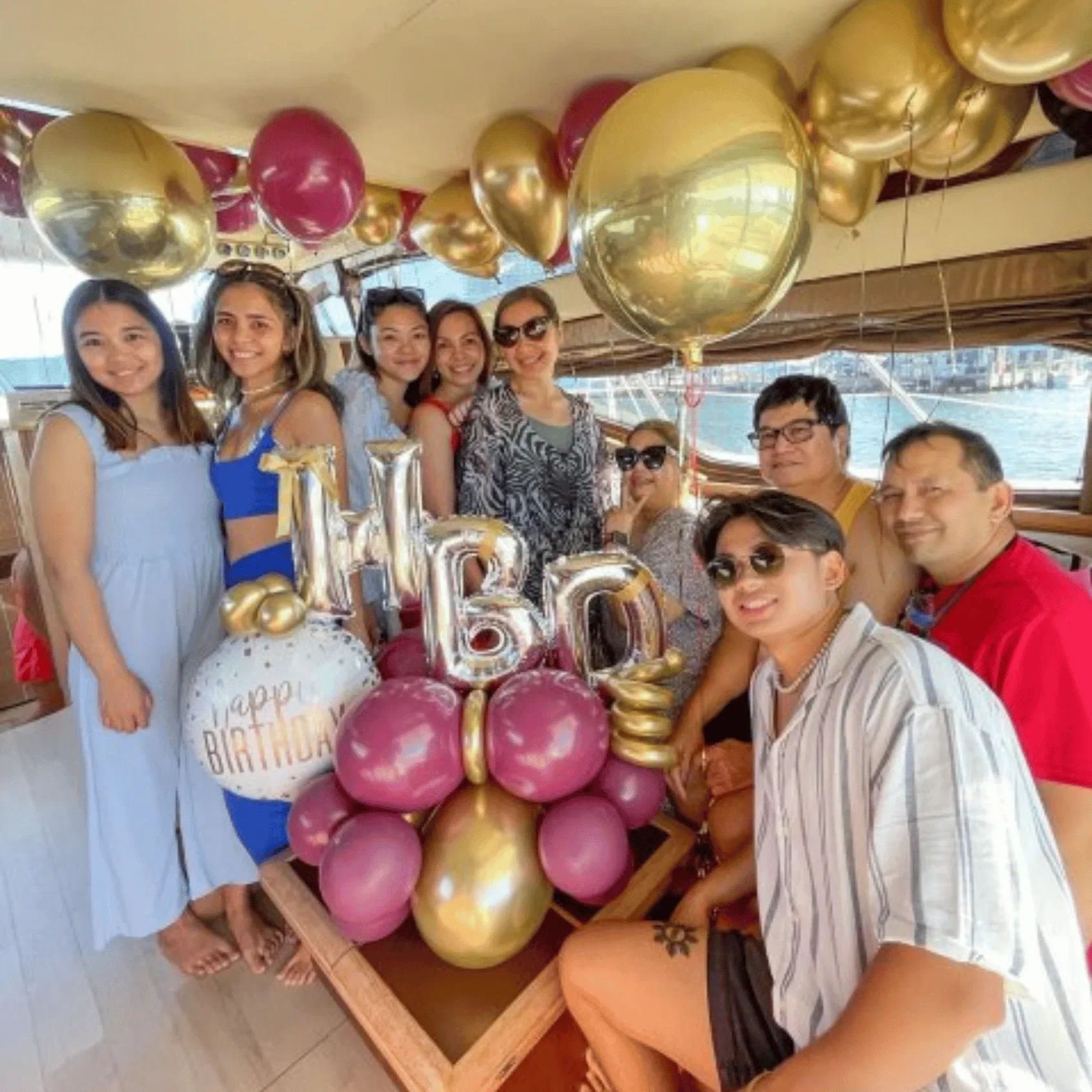 Birthday celebration with gold balloons on a yacht in Miami