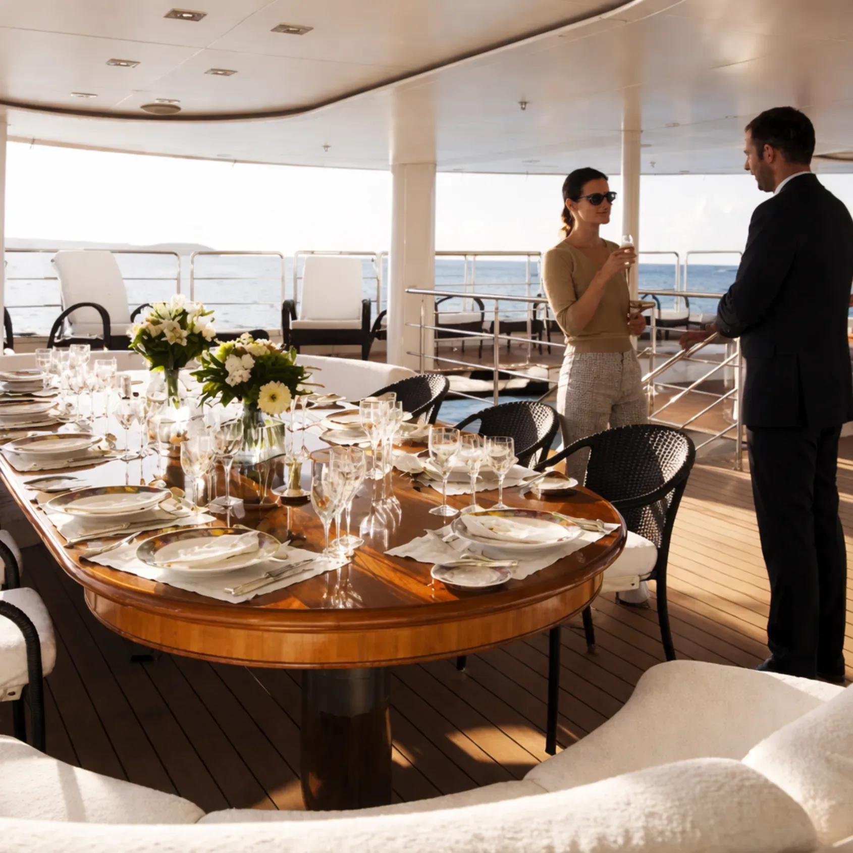 Elegant corporate dinner table setup on a luxury yacht in Miami
