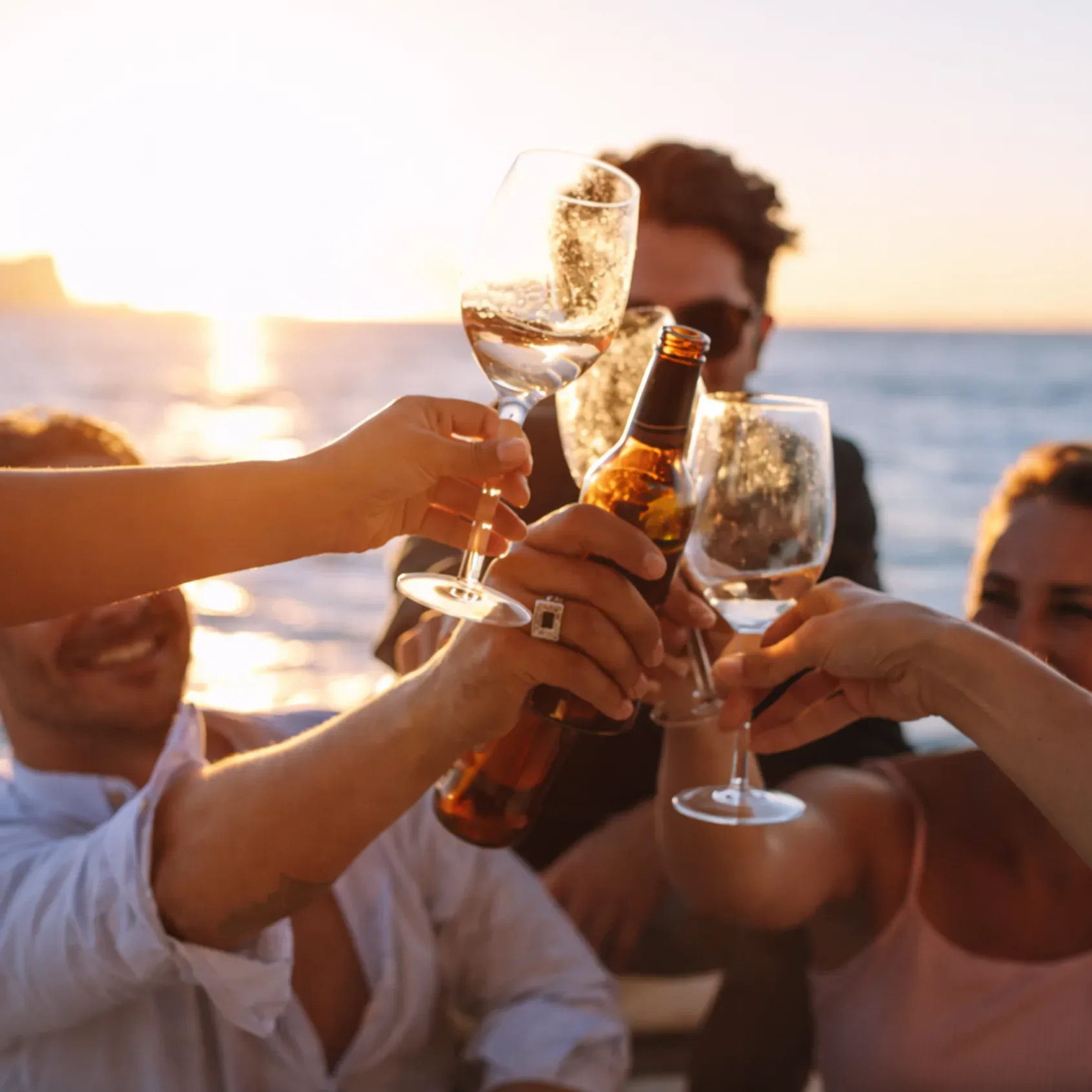 Drinks and sunset cheers at a boat party rental in Miami